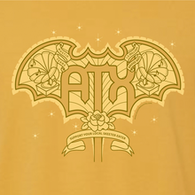 Detail of ATX Wings graphic screenprinted on front of mustard tee