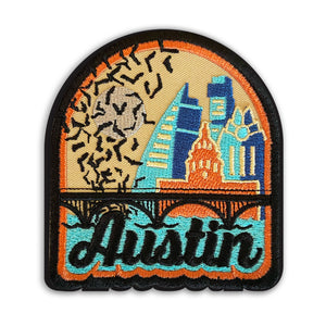 Iron on patch featuring four iconic Austin buildings, the bat bridge over water, and bats flying over a full moon