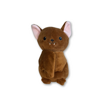 Brown bat plushie with fabric features showing the wings closed