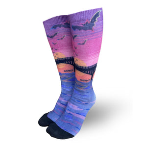 Colorful knee high tube socks depicting Austin's bat bridge with bats flying