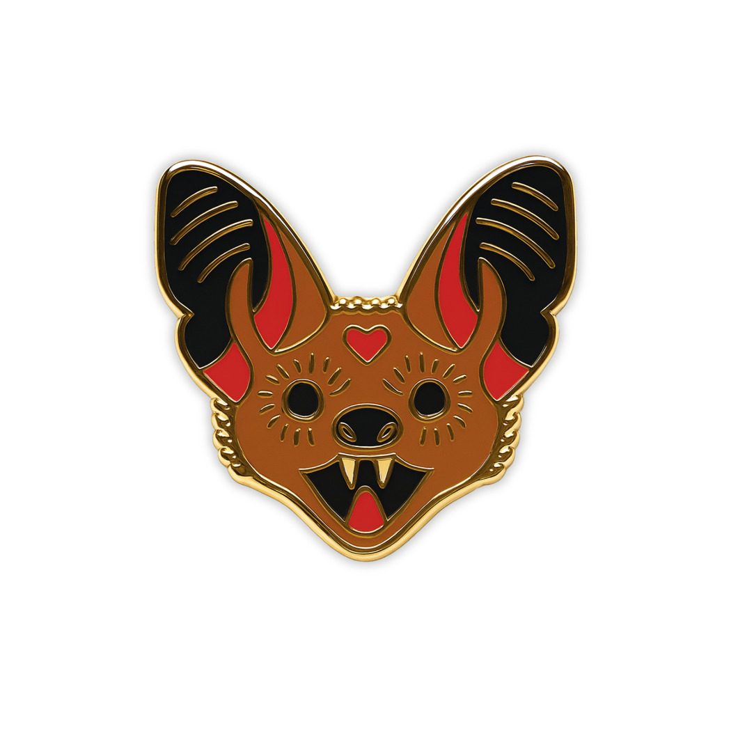 Stylized Little Brown bat head enamel pin with heart on forehead on a white background