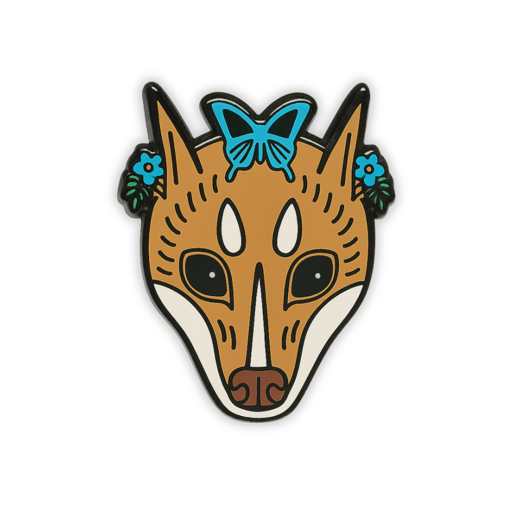 Stylized Mindoro Stripe-faced bat head enamel pin with butterfly on forehead on a white background