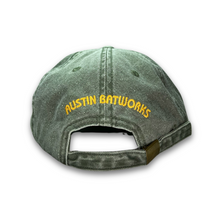 Back of khaki green cap with Austin Batworks embroidered in an arc