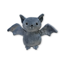 A grey plush toy shaped like a cute bat with open wings, pointed ears, black embroidered eyes and mouth details, small fangs, and small feet, shown on a plain white background.