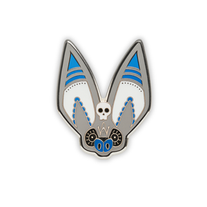 Stylized Grey Long-Eared bat head enamel pin with skull on forehead on a white background