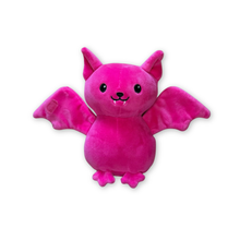 A pink plush toy shaped like a cute bat with open wings, pointed ears, black embroidered eyes and mouth details, small fangs, and small feet, shown on a plain white background.