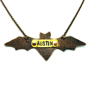 Hand cut antique copper bat necklace with Austin stamped on brass plate