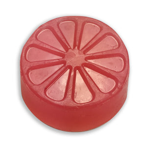 Magenta candied citrus soap from a round mold